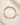 Top view of ENVYONE 18K Gold-Plated geometric link bracelet with an adjustable chain and lobster clasp displayed on natural stone.
