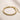 ENVYONE 18K Gold-Plated stainless steel woven mesh bracelet on a beige stone surface.