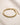ENVYONE 18K Gold-Plated stainless steel woven mesh bracelet on a beige stone surface.