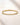 ENVYONE 18K Gold PVD-Plated stainless steel bangle with round zircon stones featured on beige natural stone.