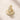 ENVYONE 18K Gold Plated huggie hoop earrings featuring rows of sparkling zircon stones, photographed on a light beige stone surface.
