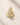 ENVYONE 18K Gold Plated huggie hoop earrings featuring rows of sparkling zircon stones, photographed on a light beige stone surface.