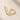 ENVYONE 18K Gold Plated huggie hoop earrings with sparkling zircon stones, displayed on a light beige stone surface.