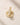 ENVYONE 18K Gold Plated hoop earrings with clear zircon stones, displayed on a textured beige stone surface.