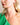 Woman wearing ENVYONE 18K Gold-Plated Emerald Cut Green Zircon gemstone stud earrings, showcasing the elegant rectangular design and polished gold-tone setting.