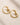 ENVYONE polished 18K Gold Plated stainless steel earrings featuring a contemporary spiral hoop design and hinged snap fastening.