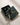 ENVYONE 18K Gold-Plated stud  925 Sterling Silver earrings displayed in an open signature dark green jewellery box, styled beside a branded gift box with ribbon on a light textured surface.