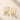 18K Gold Plated Earrings with sparkling square cut and round zircon stones, displayed on a light beige stone surface.