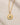Closeup ENVYONE 18K Gold Plated pendant necklace featuring an engraved evil eye design with a green cubic zirconia centre.