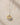 ENVYONE two-tone pendant necklace with 18K Gold-Plated detailing and a fine silver-tone chain displayed on beige stone surface.