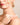 Woman wearing ENVYONE 18K Gold Plated eternity rings with sparkling white zircon stones.