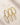 Three ENVYONE 18K Gold-Plated eternity bands featuring round and pavé-set zircon stones on a beige stone textured background.