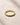 ENVYONE black zircon eternity style ring with 18K Gold Plating, photographed on a neutral textured stone surface.