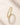 Close-up of a 18K Gold-Plated eternity ring featuring round clear stones and intricate textured settings.