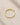 ENVYONE 18K Gold Plated 925 Sterling Silver ring with marquise-cut and round zircon stones displayed on natural stone.