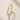 Closeup of an ENVYONE 18K Gold Plated ring featuring brilliant white zircon stones and intricate detailing.
