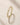 Closeup of an ENVYONE 18K Gold Plated ring featuring brilliant white zircon stones and intricate detailing.