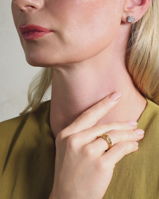 Video of woman styling an ENVYONE 18K Gold Plated adjustable stainless steel ring with a polished organic design.