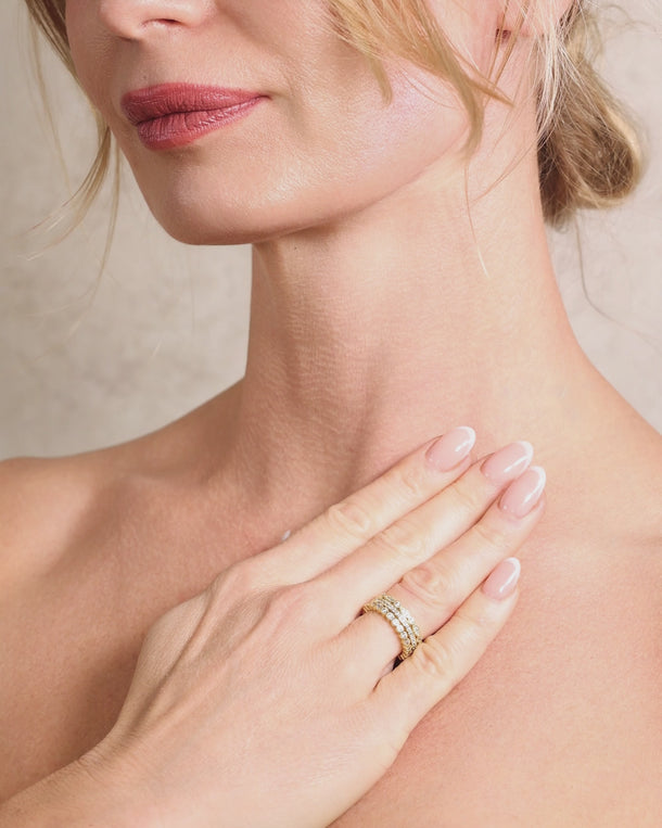 Closeup video of a woman wearing ENVYONE 18K Gold Plated zircon stacking rings