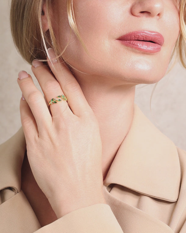 Closeup video of a Woman wearing an ENVYONE 18K Gold Plated 925 Sterling Silver green zircon adjustable ring.